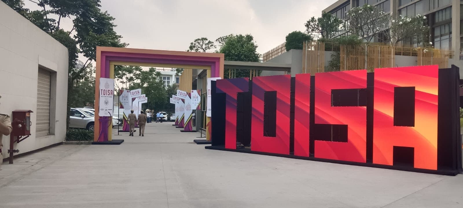Giant illuminated TOISA letter installation at the venue entrance