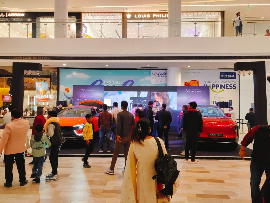 Mall floor brand activation with engaged crowd